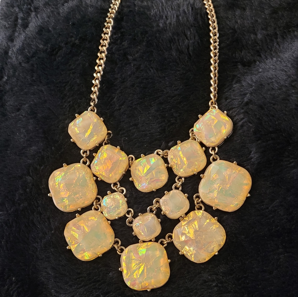 Iridescent yellow opalescent necklace and earring set. New with. Tags